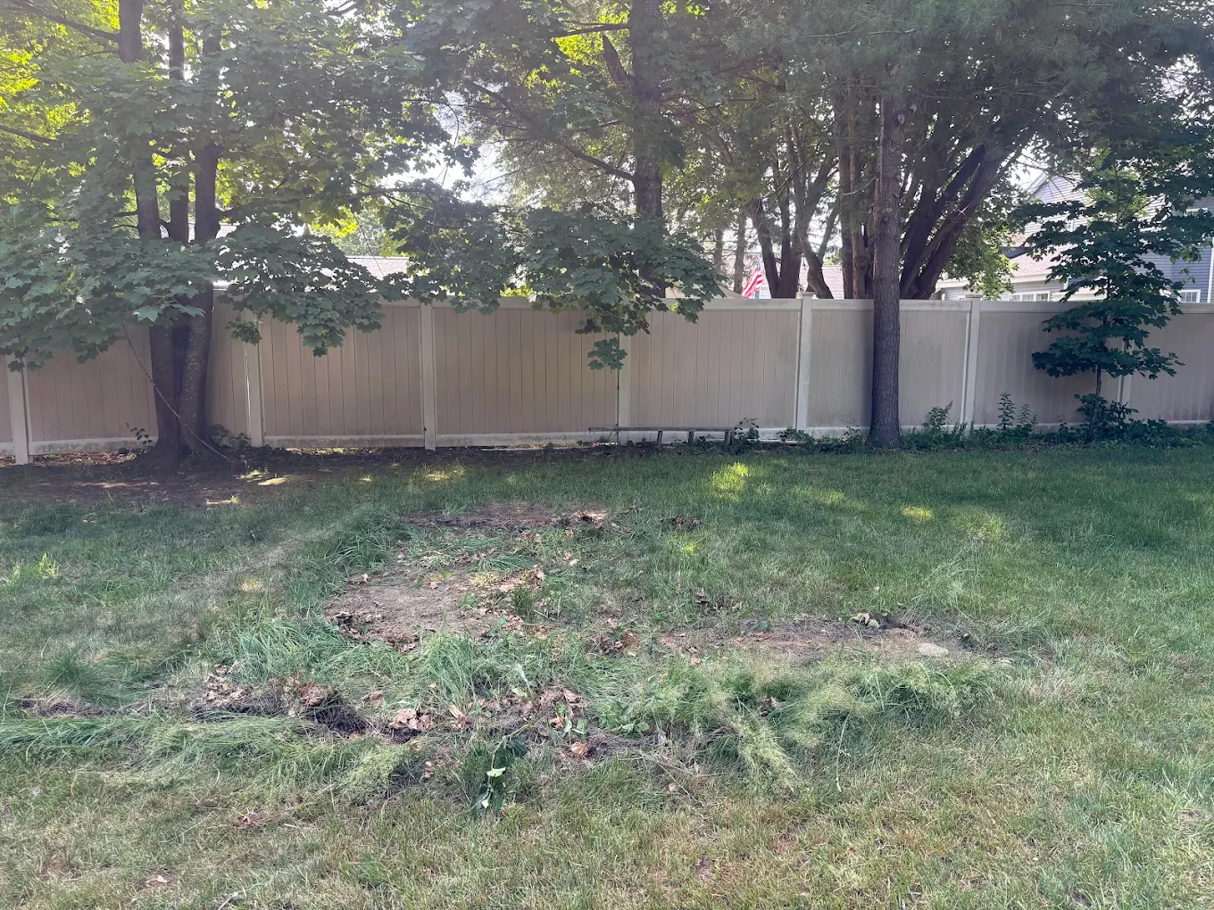 After — Backyard raked clean after playset demolition